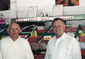 Humble origins as a family butcher in Penrith. Pictured with his first employer and mentor Hal Morris (left) 